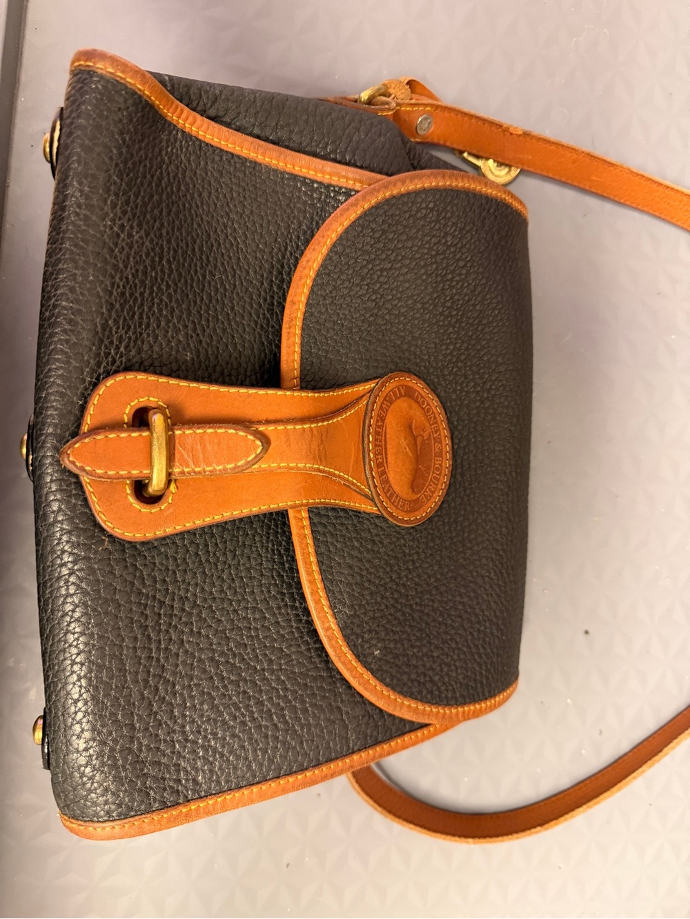 Dooney & Bourke Black Pebbled Leather Crossbody with Tan Trim and Logo Tab